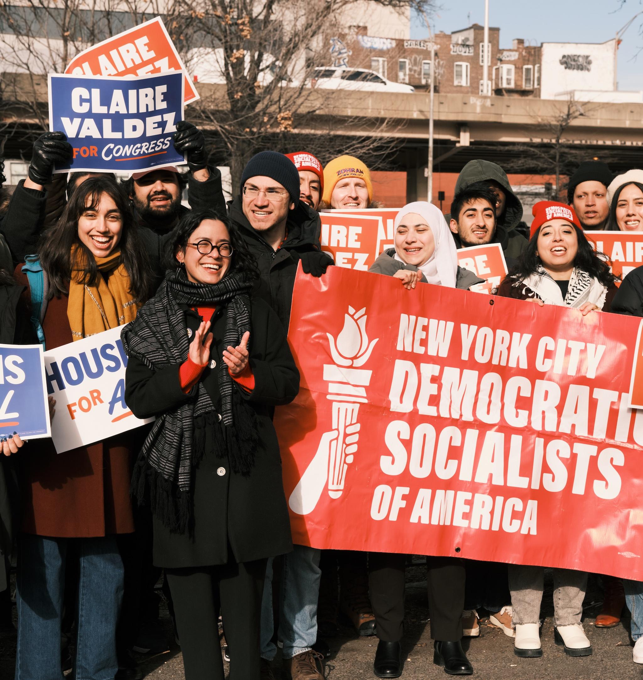 Claire Valdez stands with a crowd of supporters at her NYC DSA endorsement event